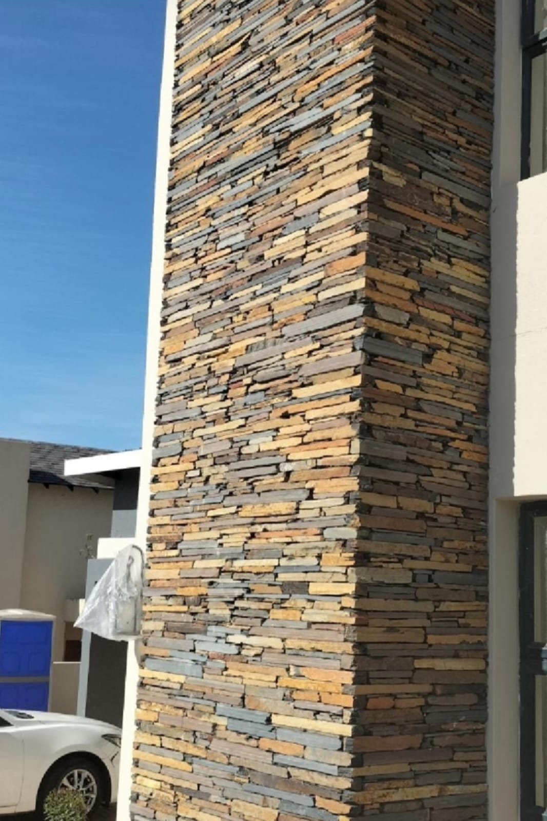 Stacked slate stone cladding corner detail by Best Tilers and Builders