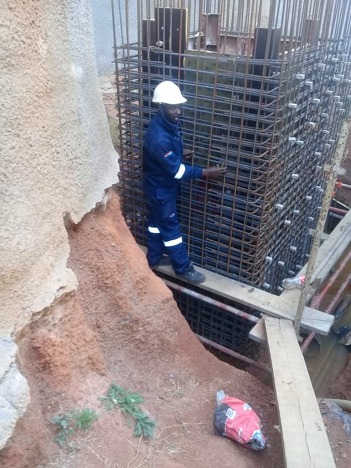 Steel fixer working on a column reinforcement cage