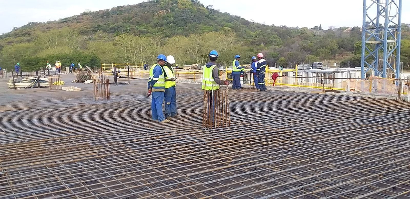 Reinforcement mesh laid out on a concrete slab